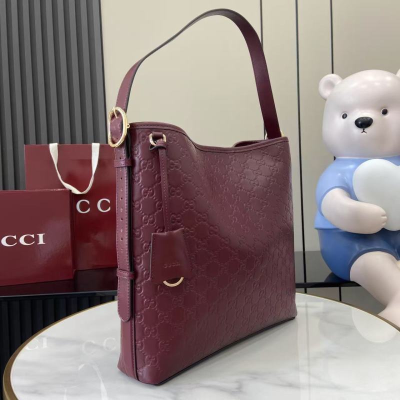 Сумка Gucci бордовая с тиснением