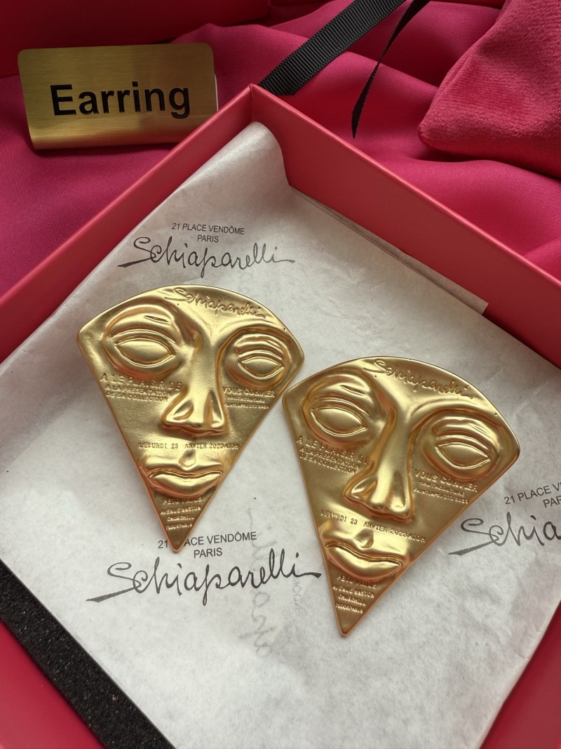 Серьги в форме лица Schiaparelli