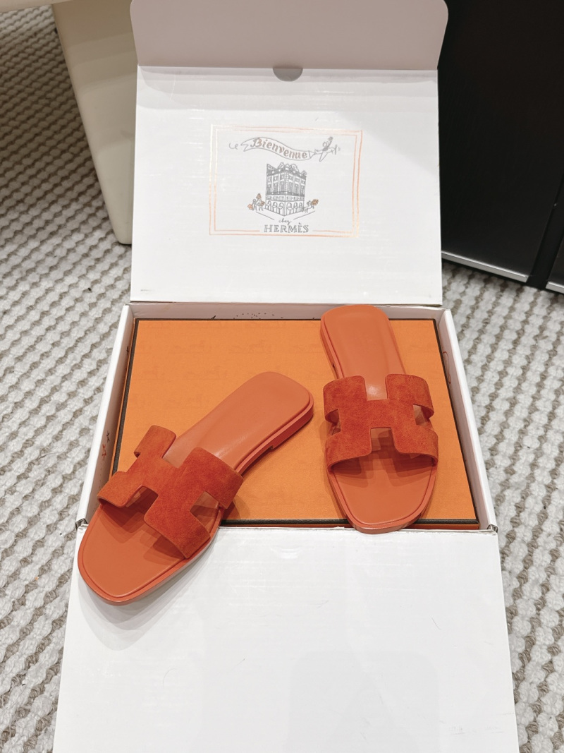 Женские шлепанцы с орнаментом H оранжевого цвета Hermès