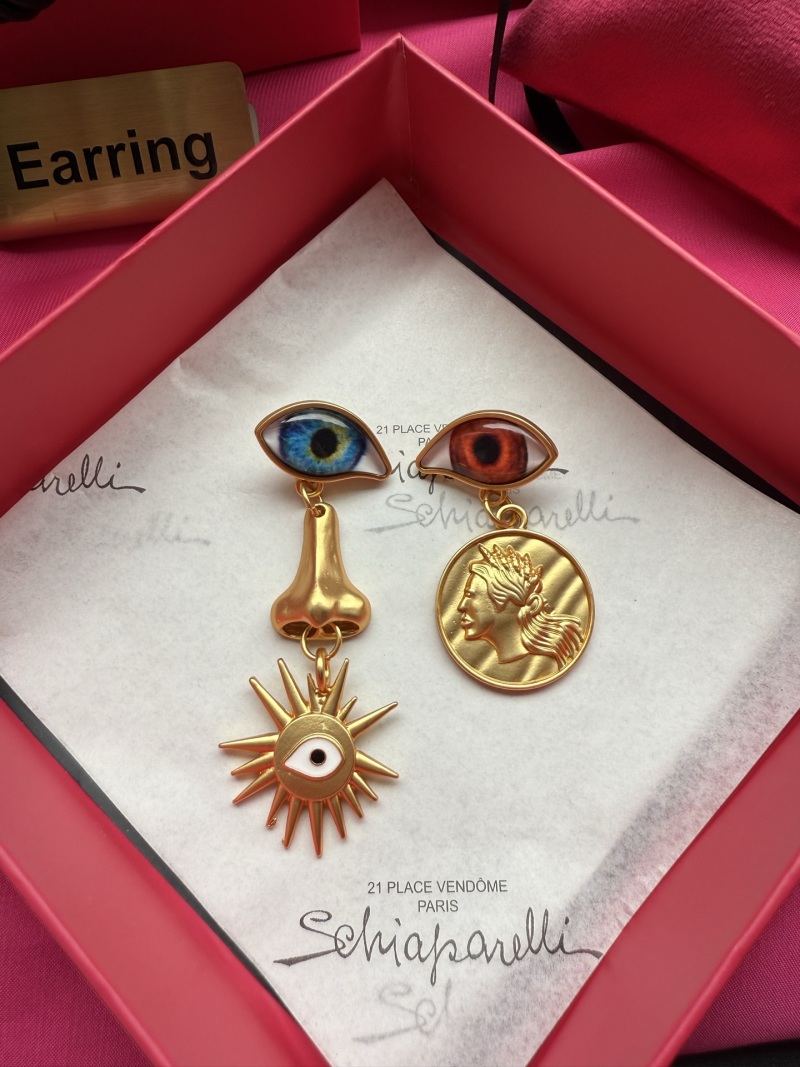 Серьги Schiaparelli с глазами и монетой