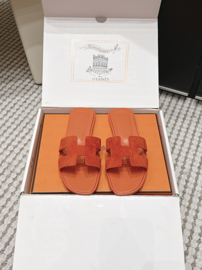 Женские шлепанцы с орнаментом H оранжевого цвета Hermès