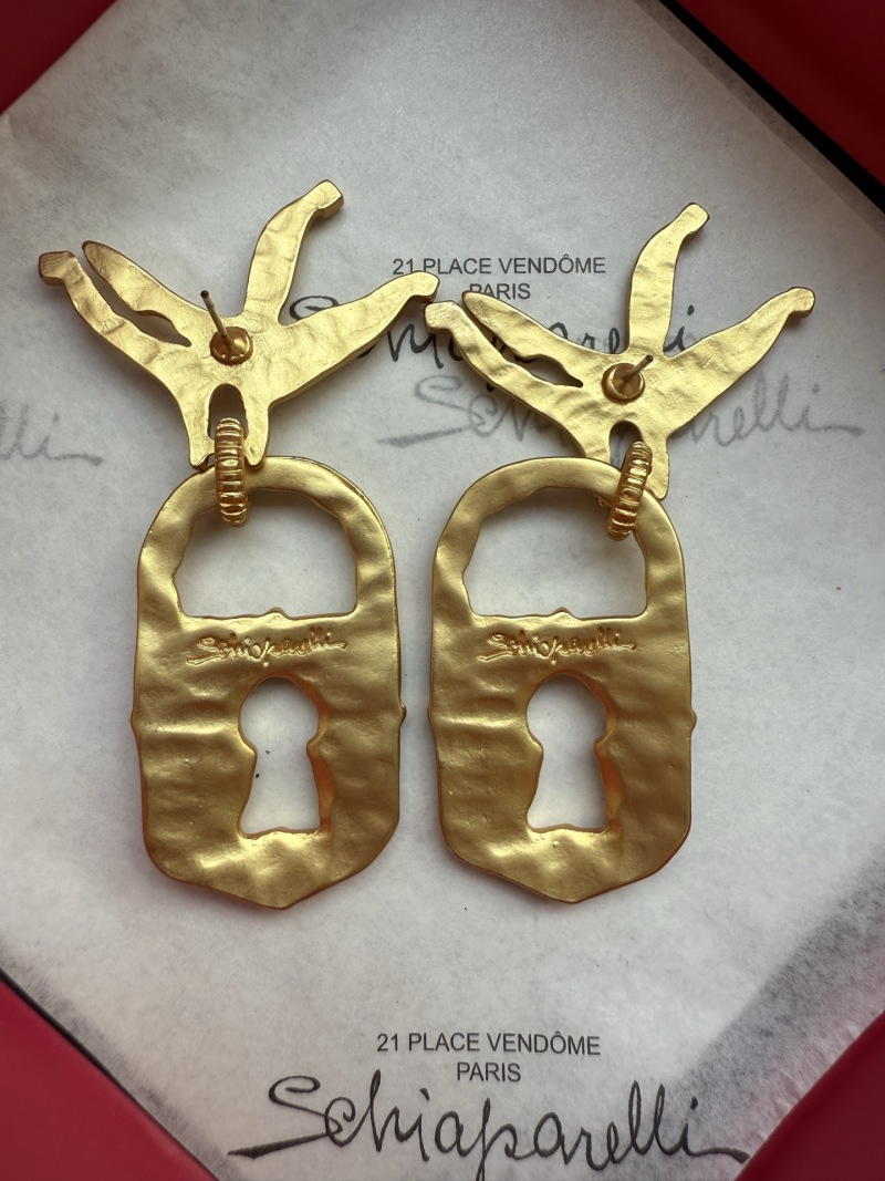 Серьги Schiaparelli в виде птиц с ключом