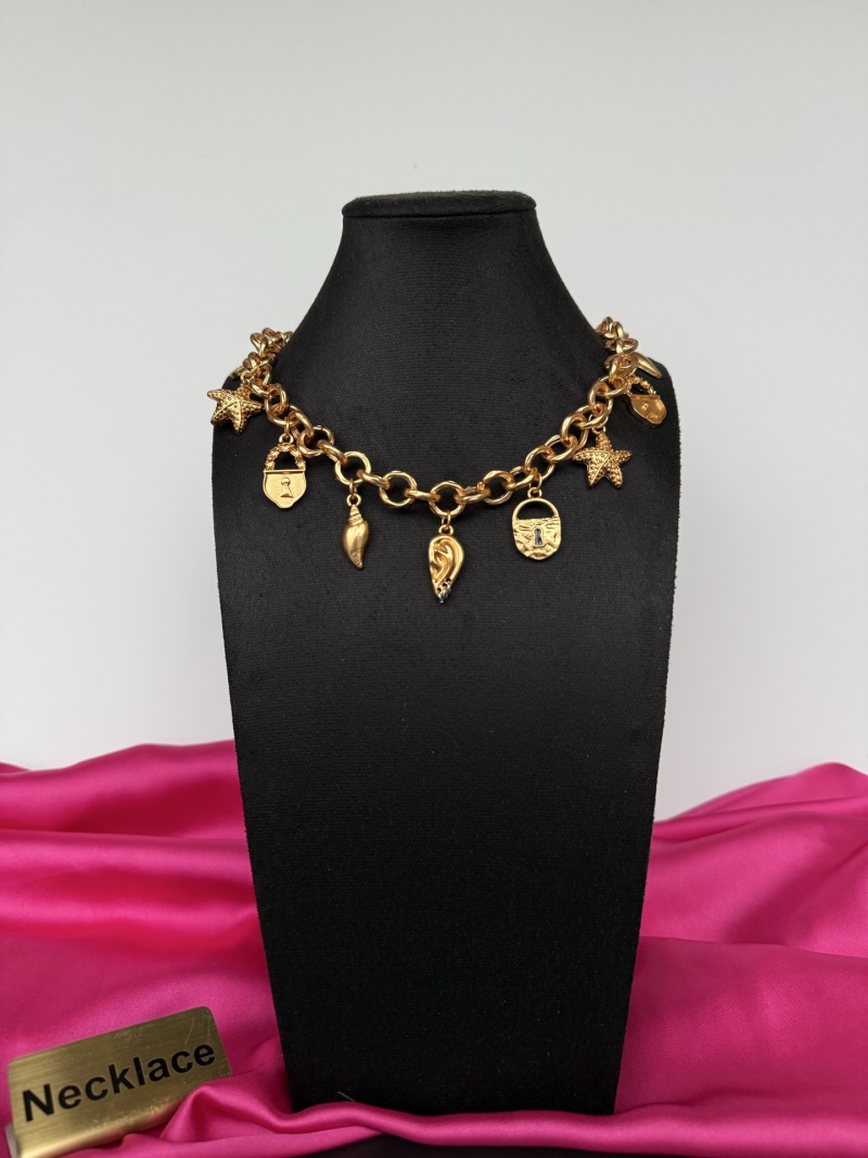 Золотистое колье с подвесками Schiaparelli