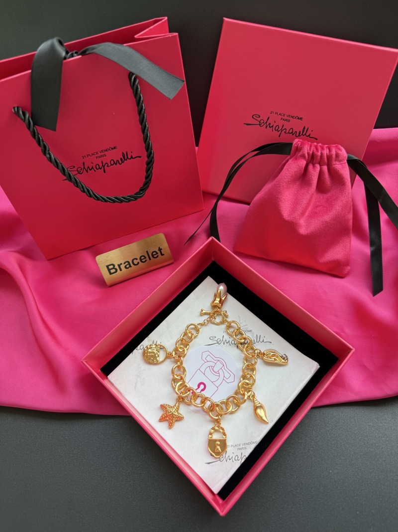 Золотистый браслет с подвесками Schiaparelli