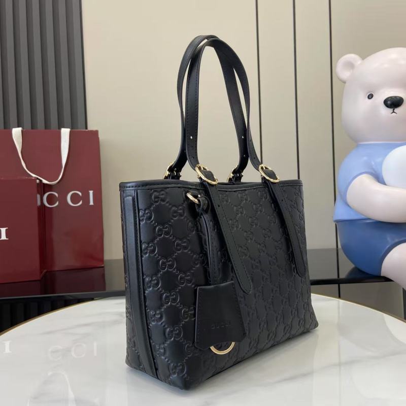 Черная кожаная сумка-тоут Gucci с тиснением