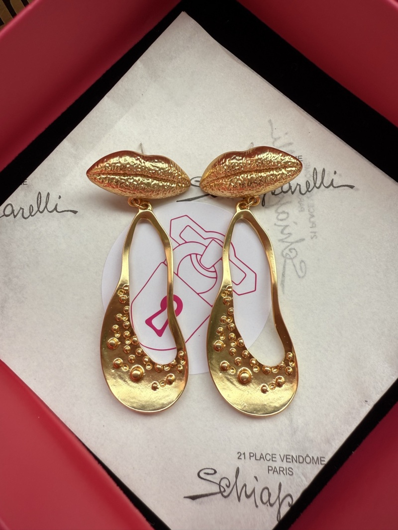 Золотистые серьги в форме губ Schiaparelli