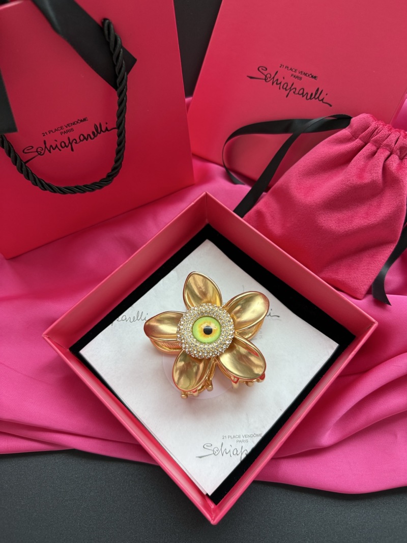 Брошь в виде цветка с глазом Schiaparelli