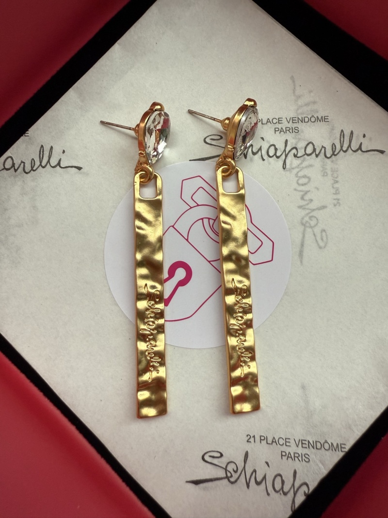 Серьги с кристаллами и золотистой подвеской Schiaparelli