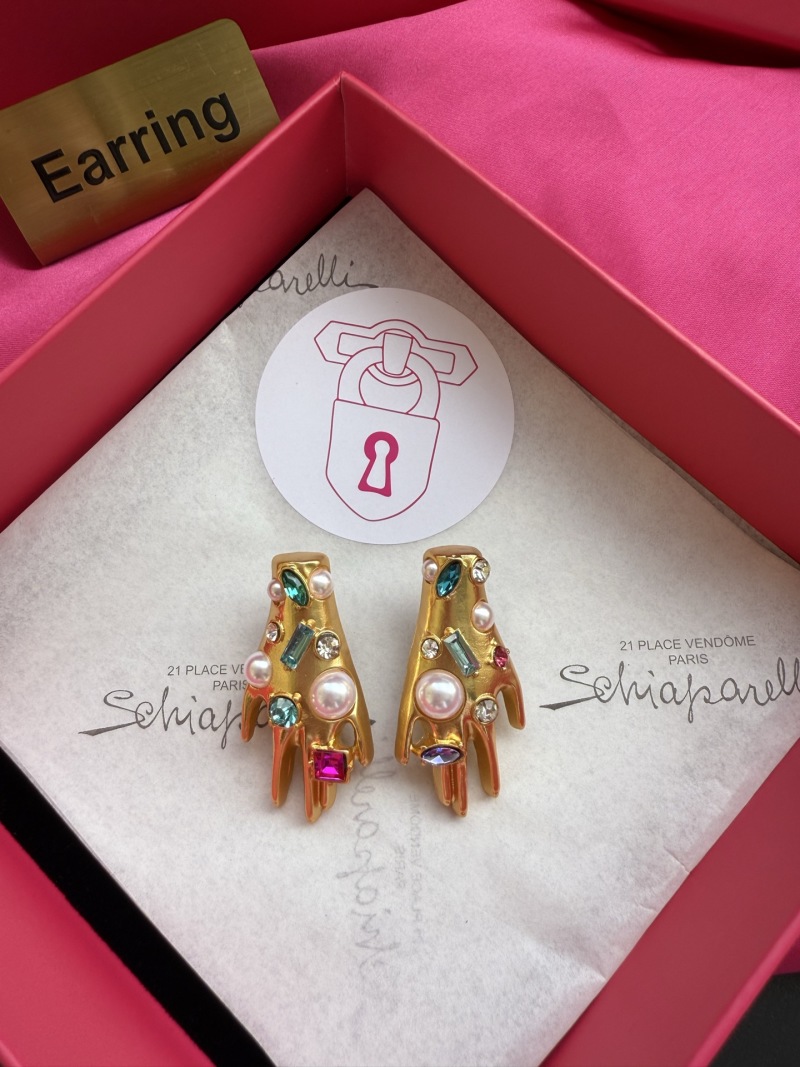 Серьги в виде рук с камнями Schiaparelli