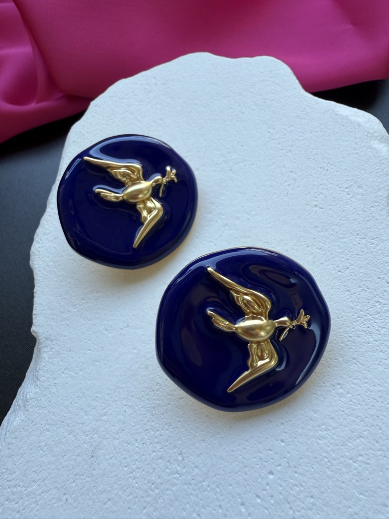 Серьги Schiaparelli с золотым орлом на синем фоне