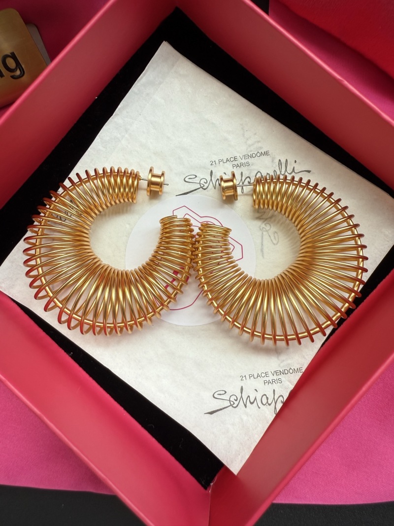 Золотистые серьги-кольца с витой конструкцией Schiaparelli