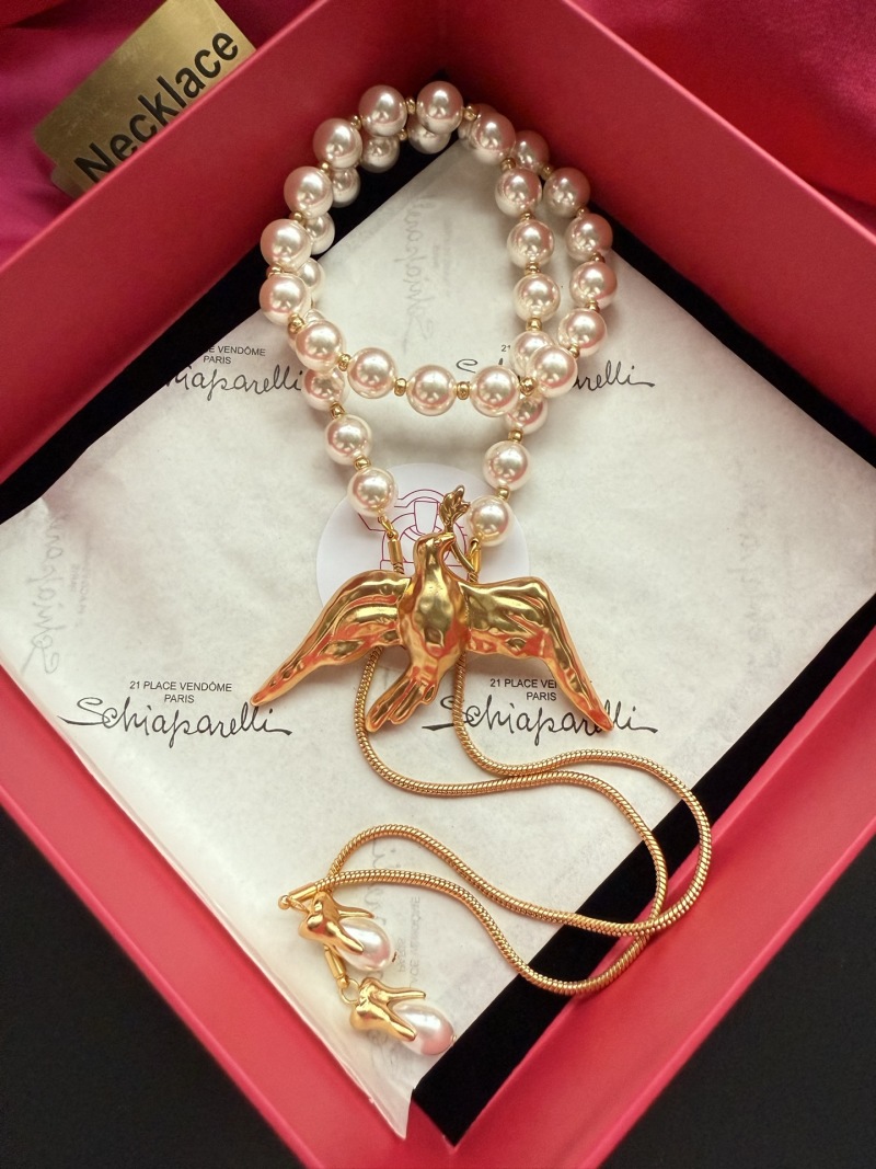 Набор из бус и колье с птицей Schiaparelli