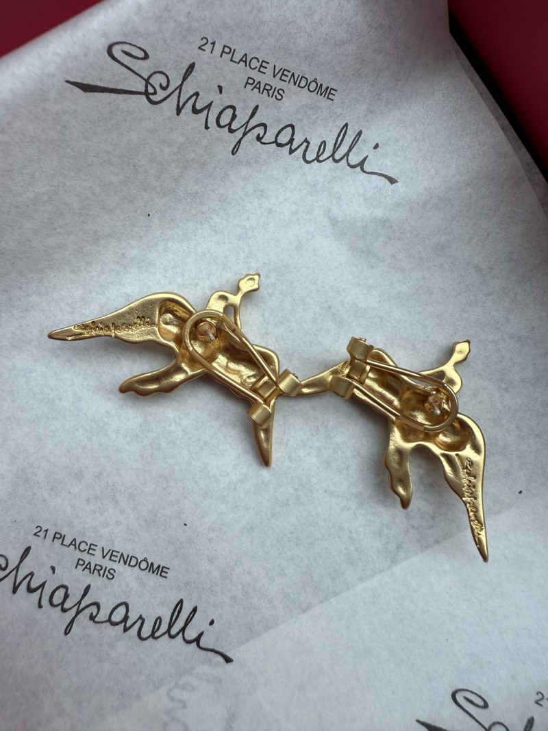 Серьги Schiaparelli в виде фигур
