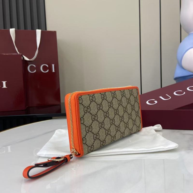 Кошелёк Gucci с монограммой и оранжевой окантовкой