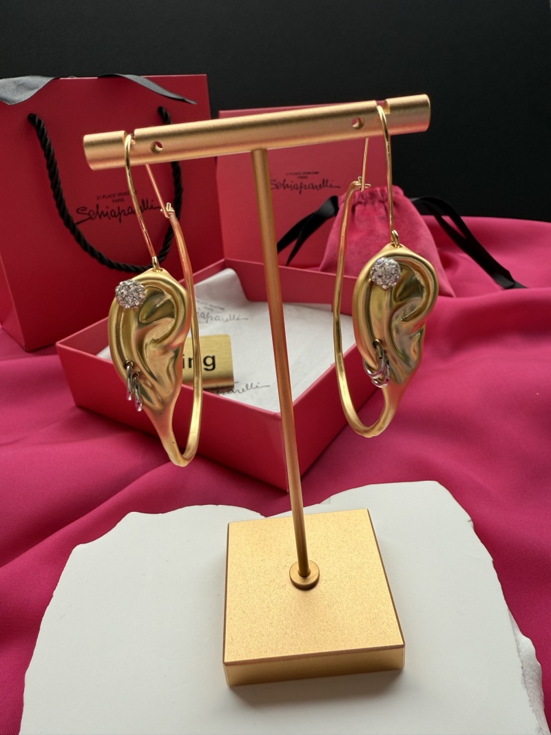 Серьги в форме уха с камнями Schiaparelli