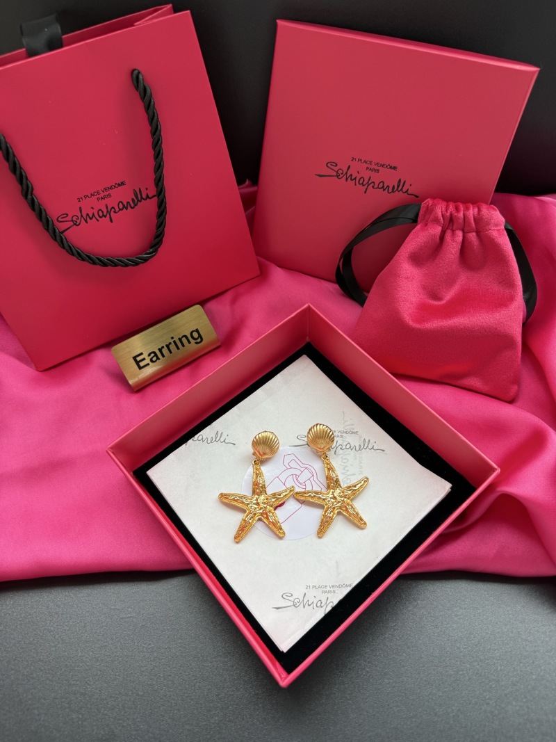 Золотистые серьги в виде звезды Schiaparelli