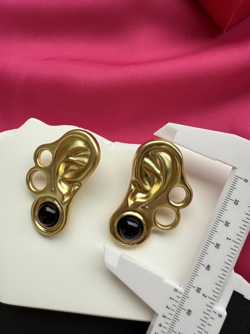 Серьги в форме уха с черными камнями Schiaparelli
