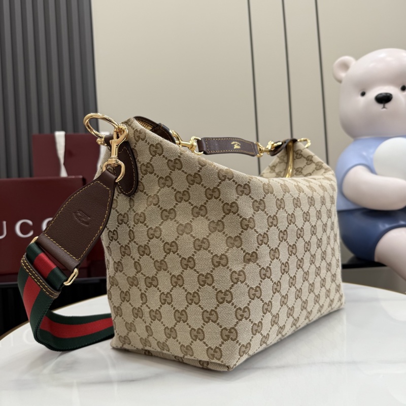 Сумка Gucci с канвой и кожаной ручкой