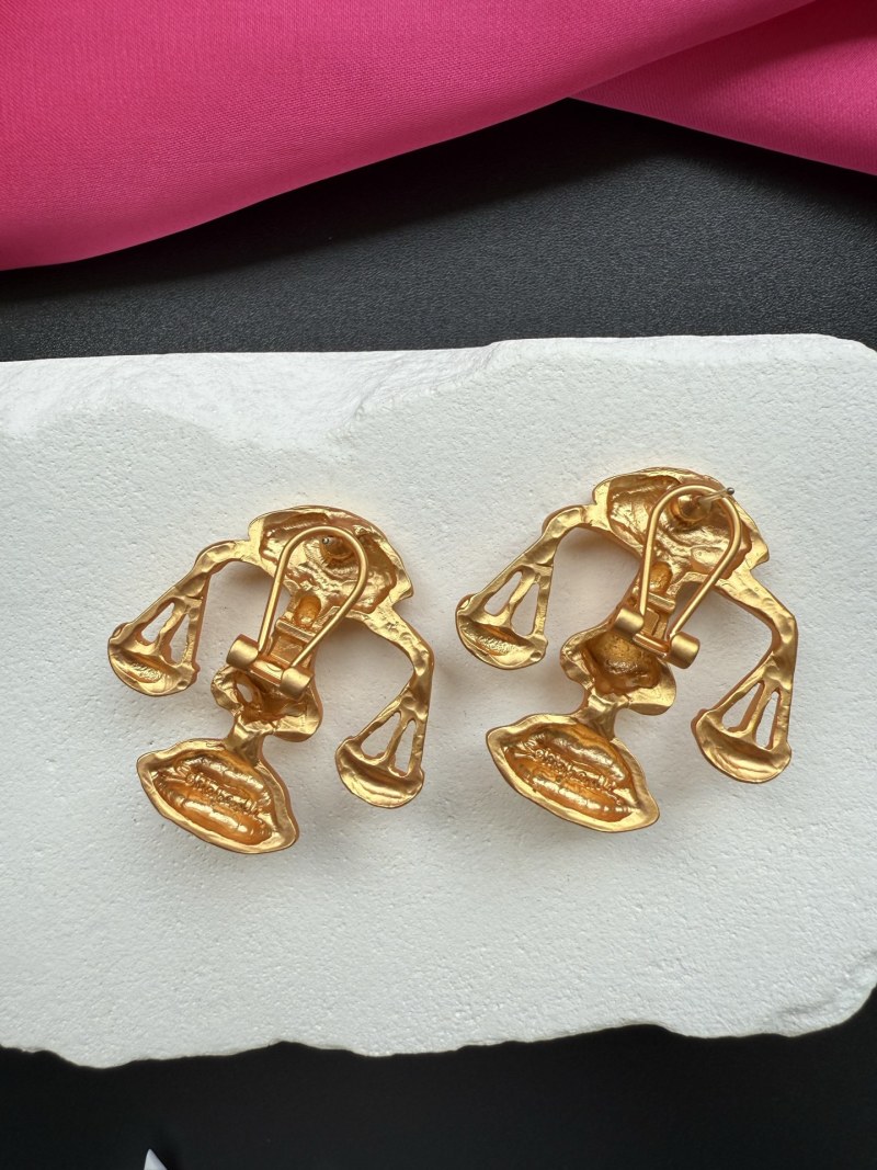 Серьги Schiaparelli с изображением весов и глаза