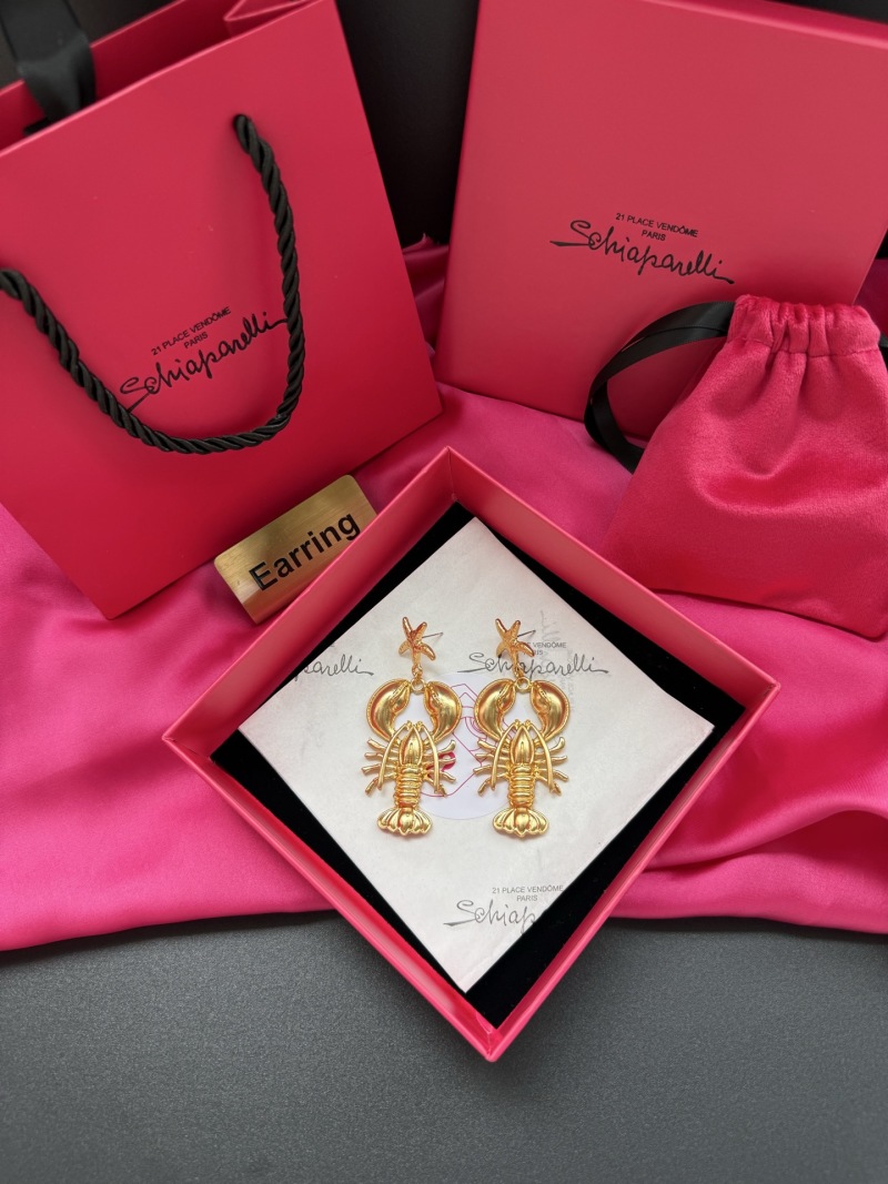 Золотистые серьги в виде крабов Schiaparelli