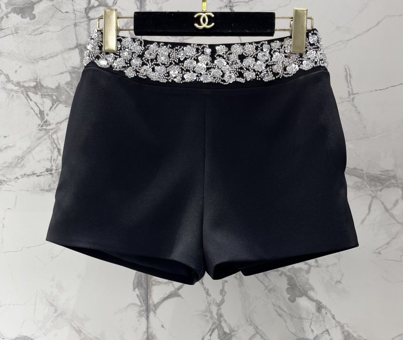 Чёрные брюки Chanel с кружевной отделкой