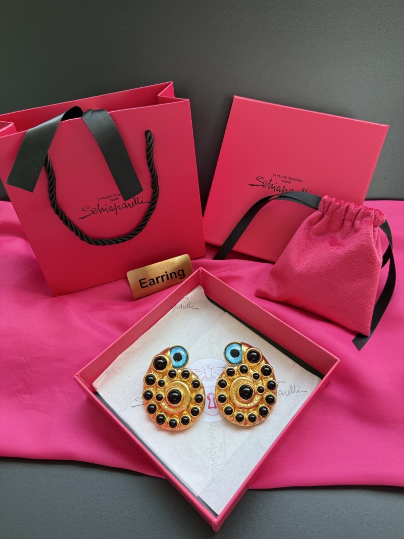 Серьги Schiaparelli с глазами и черными камнями