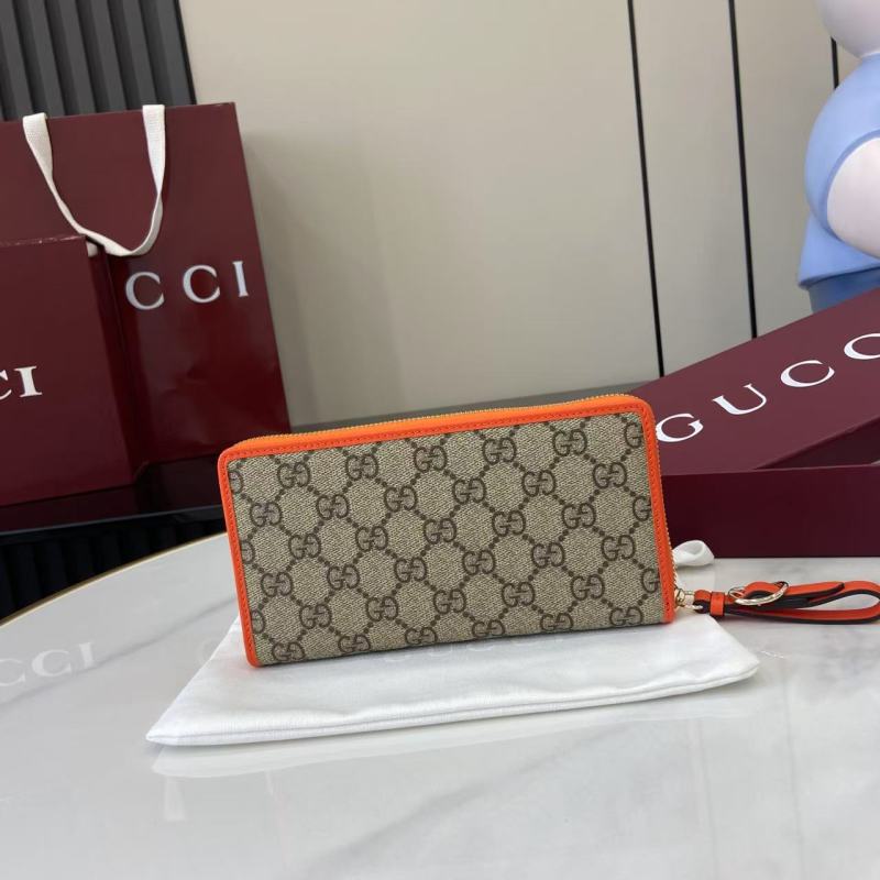 Кошелёк Gucci с монограммой и оранжевой окантовкой