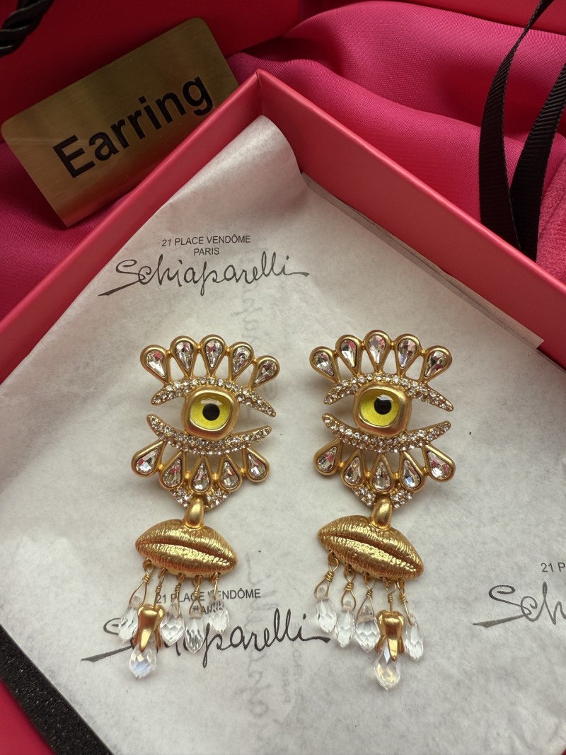 Серьги Schiaparelli с глазом и кисточками