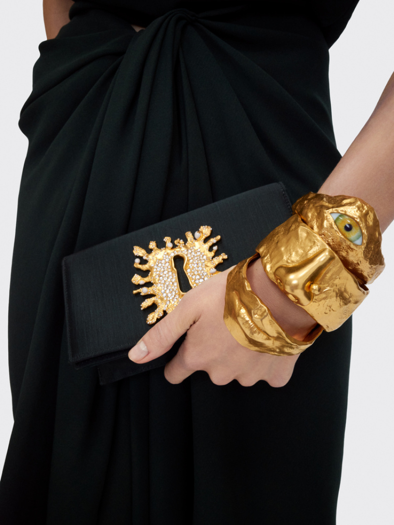 Золотистое кольцо с лицом и глазом Schiaparelli