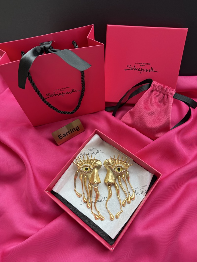 Серьги Schiaparelli с глазами и золотыми деталями
