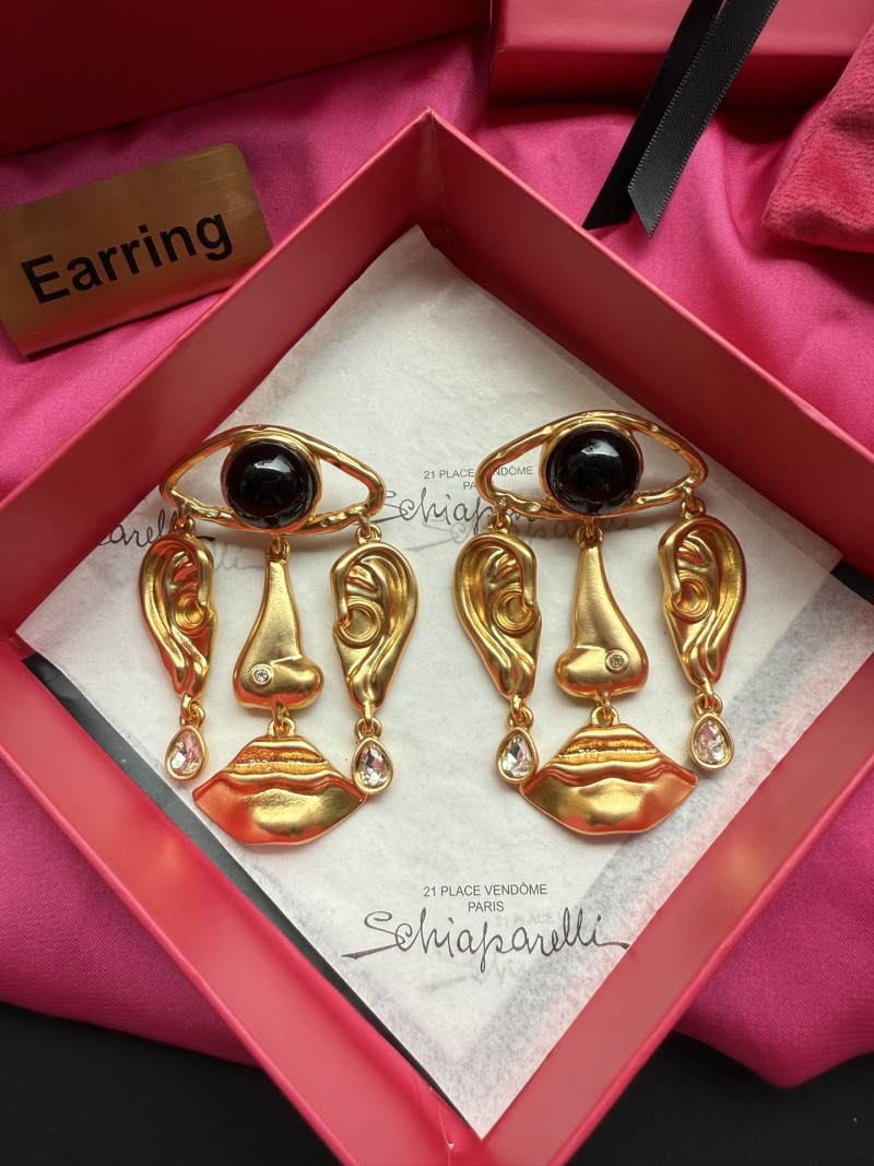 Серьги Schiaparelli с глазом и губами
