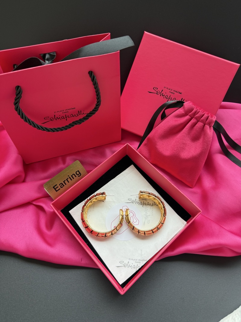 Золотистые серьги с кристаллами Schiaparelli