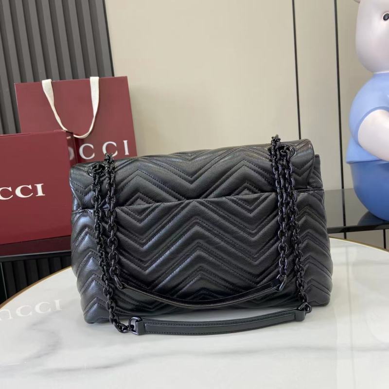 Черная сумка Gucci с кисточкой