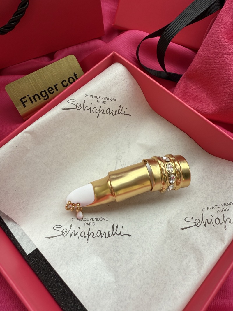 Комплект бижутерии в виде косметического аппарата Schiaparelli