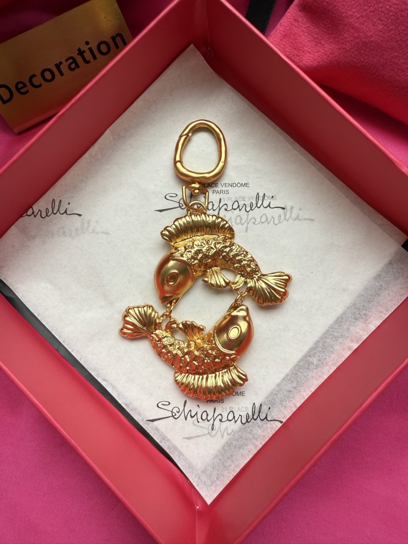Золотистый брелок в виде двух рыб Schiaparelli