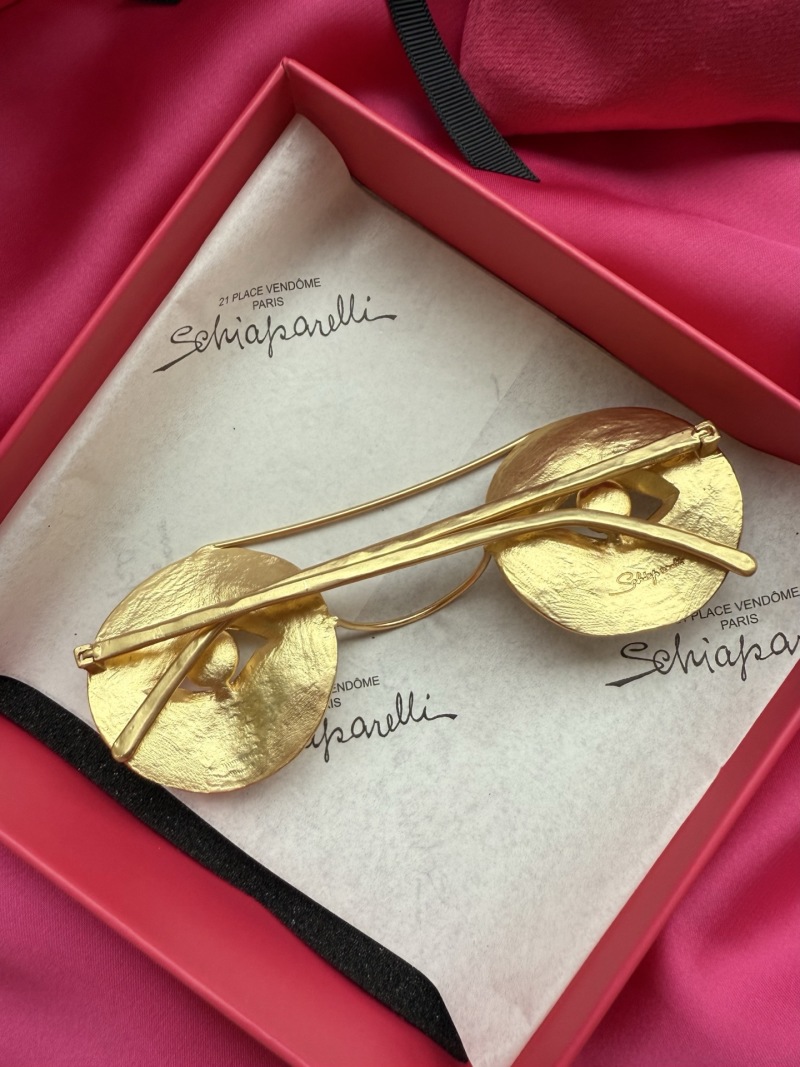 Брошь в виде очков с глазами Schiaparelli