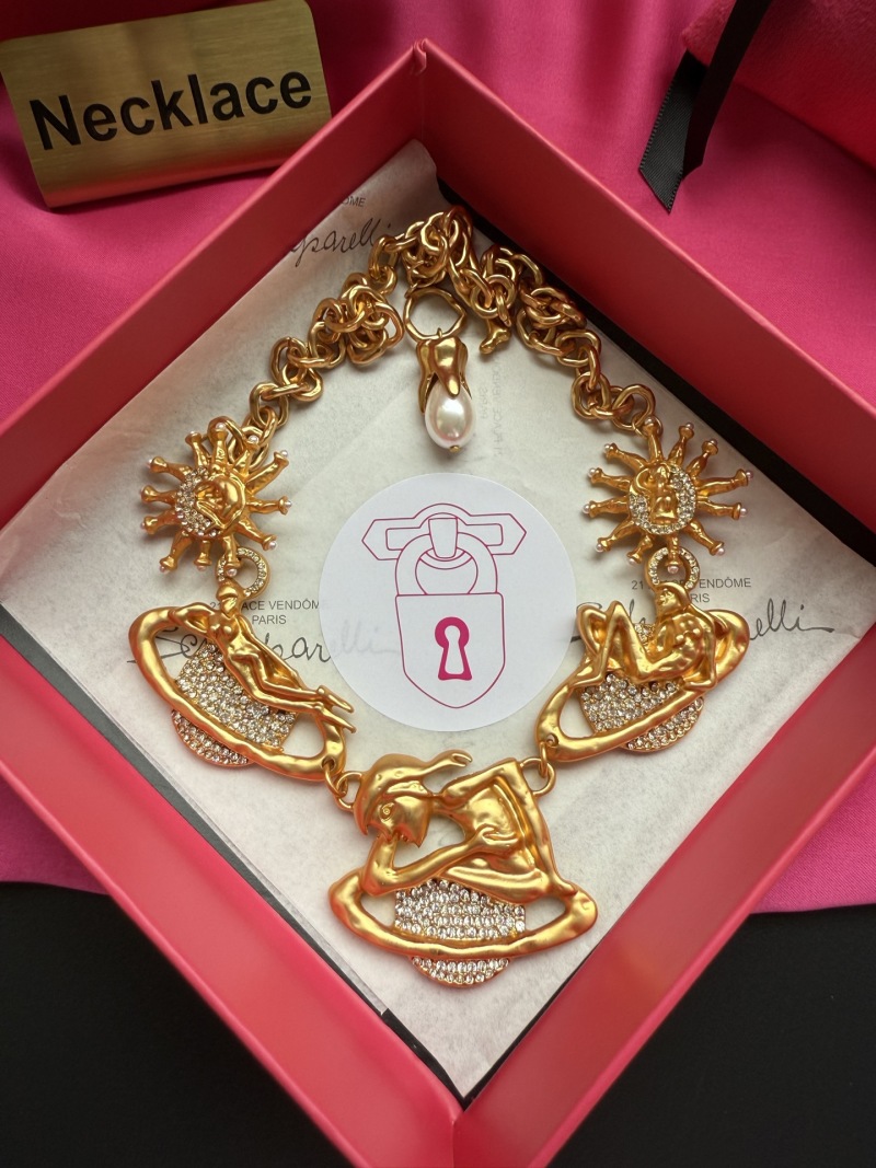 Золотистое колье с кристаллами и декоративными элементами Schiaparelli