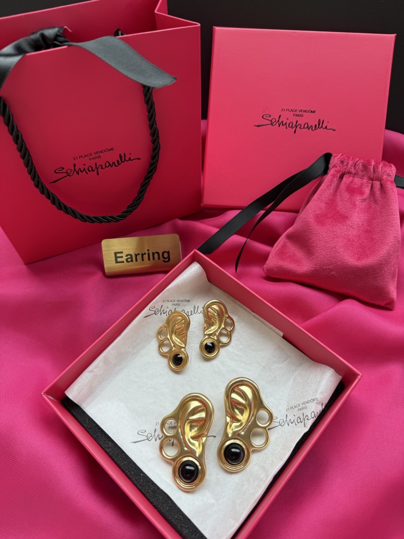 Серьги в форме уха с черными камнями Schiaparelli