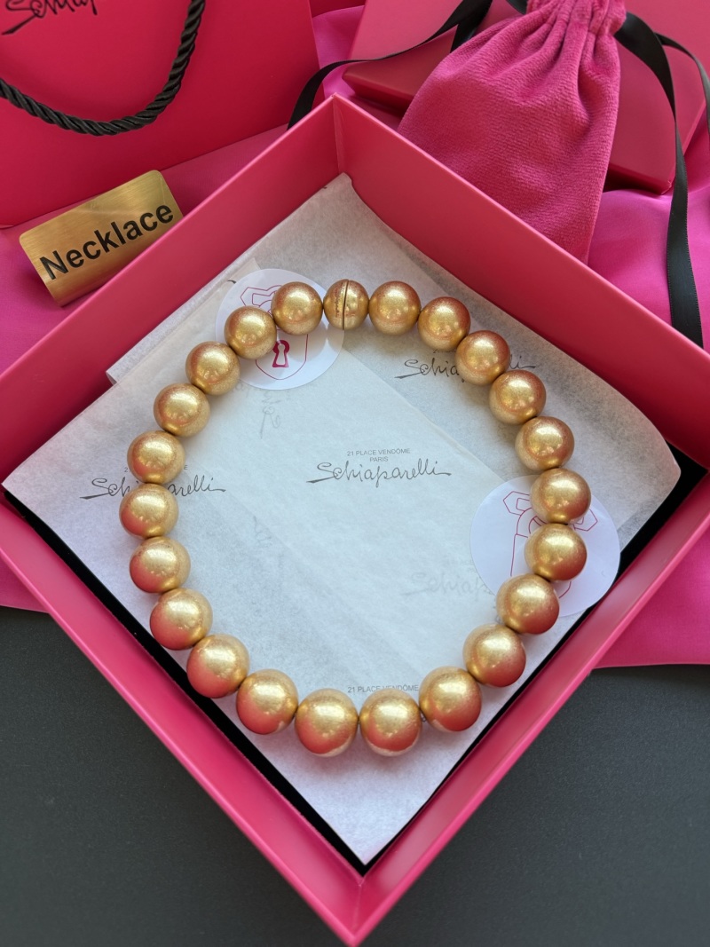 Колье из золотистых бусин Schiaparelli