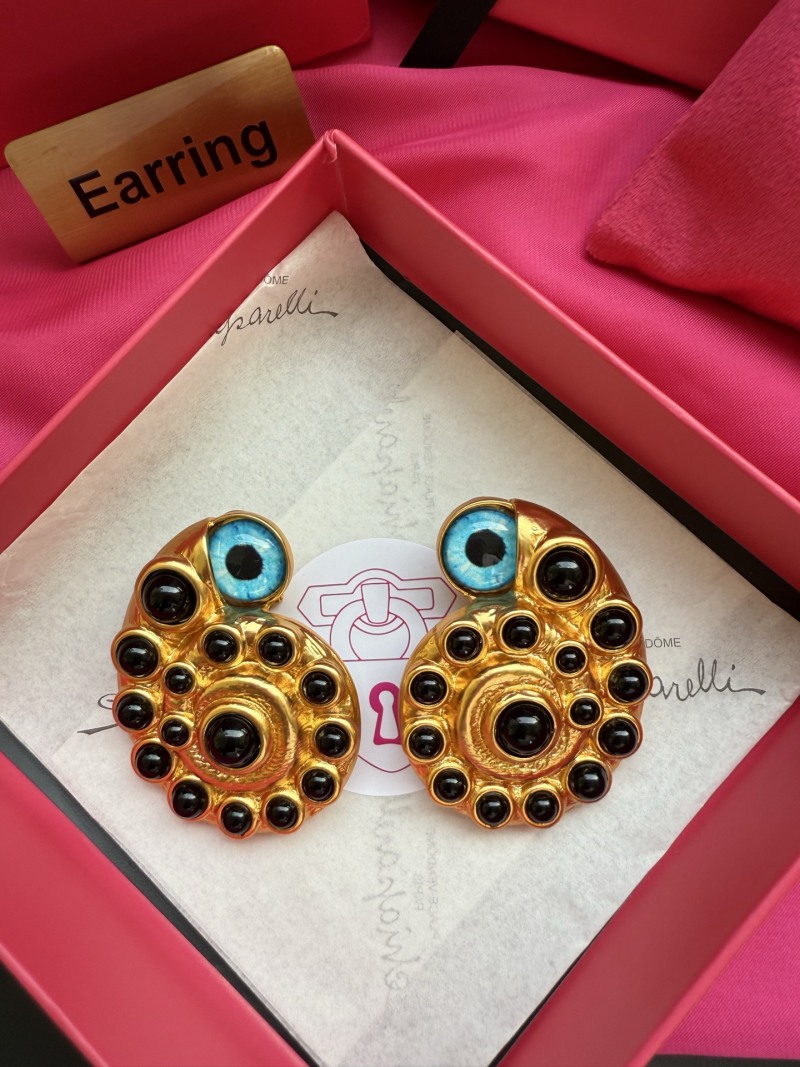 Серьги Schiaparelli с глазами и черными камнями