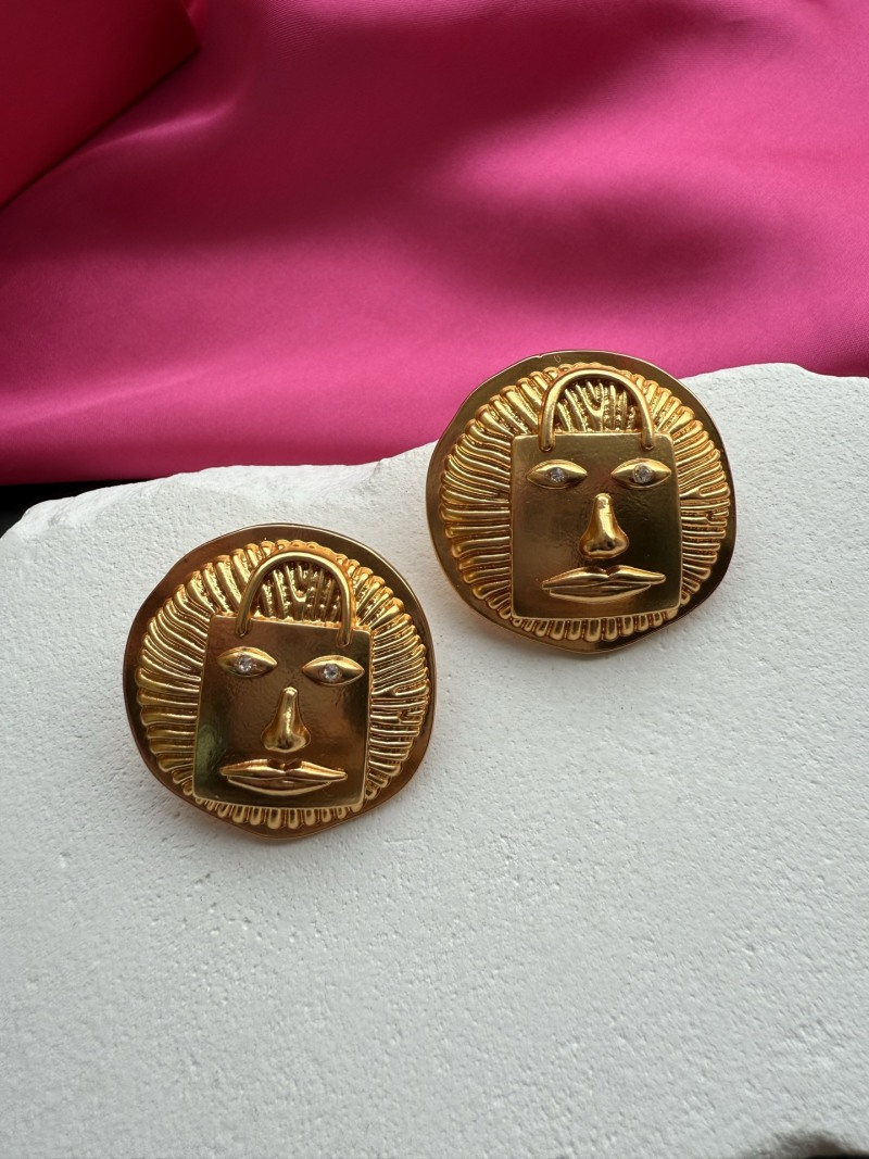 Серьги Schiaparelli с лицом и сумкой