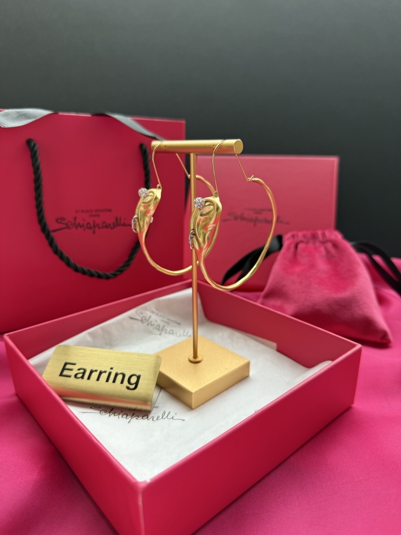 Серьги в форме уха с камнями Schiaparelli