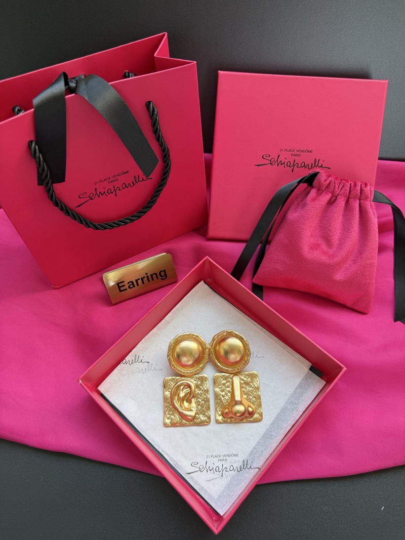 Золотистые серьги в форме уха и носа Schiaparelli