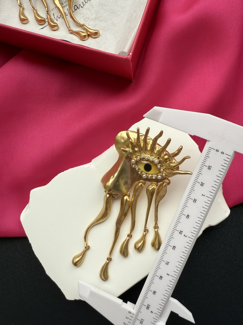 Серьги Schiaparelli с глазами и золотыми деталями