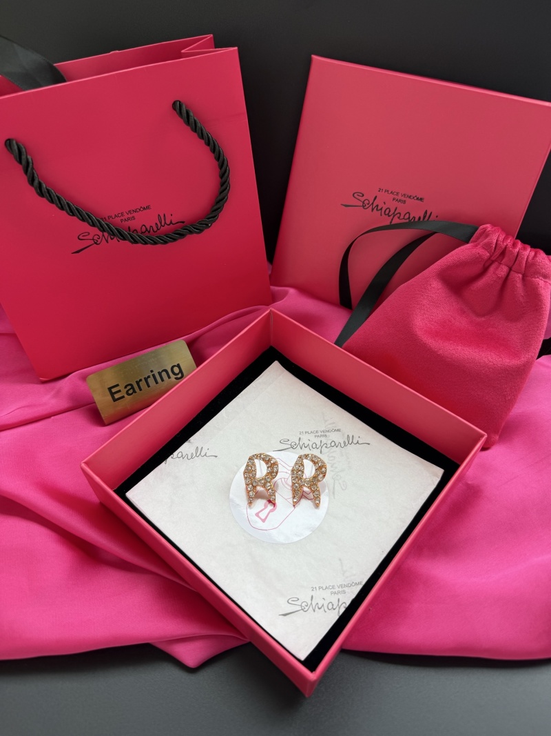 Серьги Schiaparelli в виде букв 'PR' с кристаллами