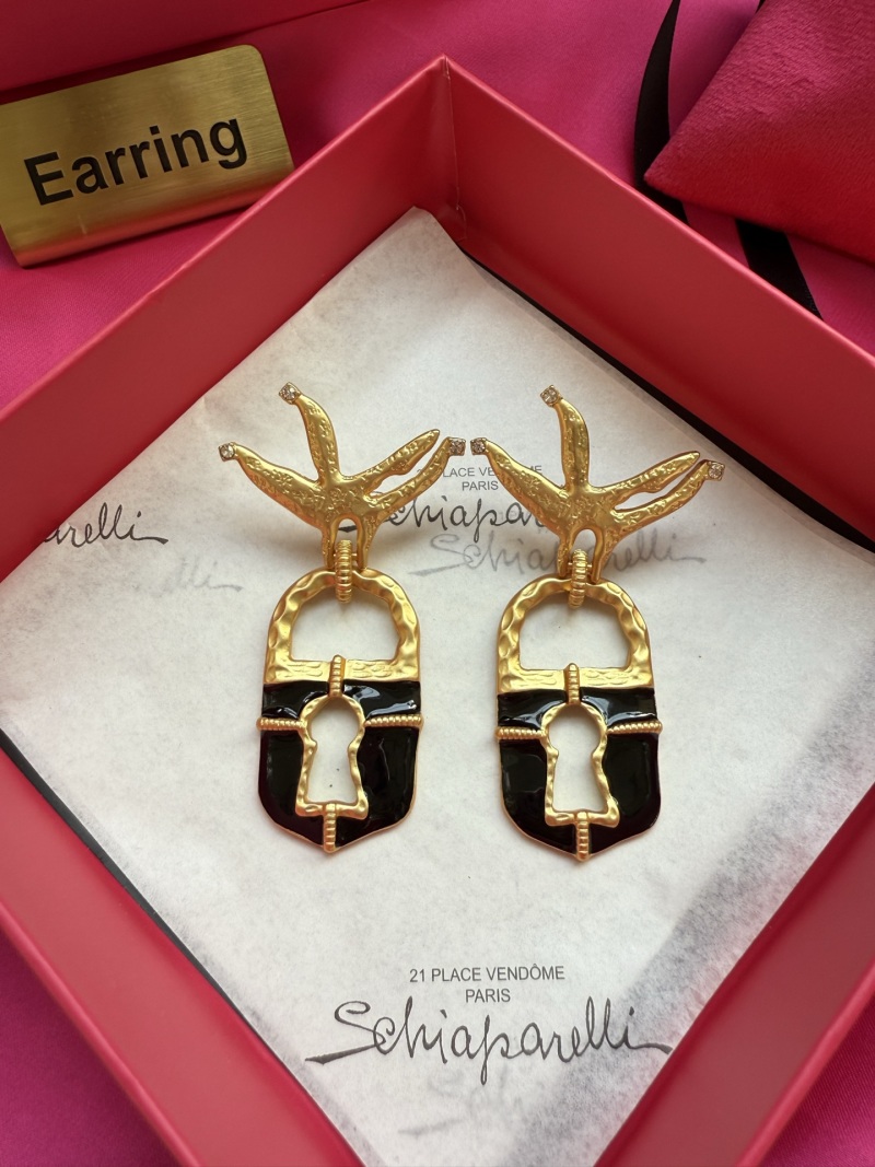 Серьги Schiaparelli в виде птиц с ключом