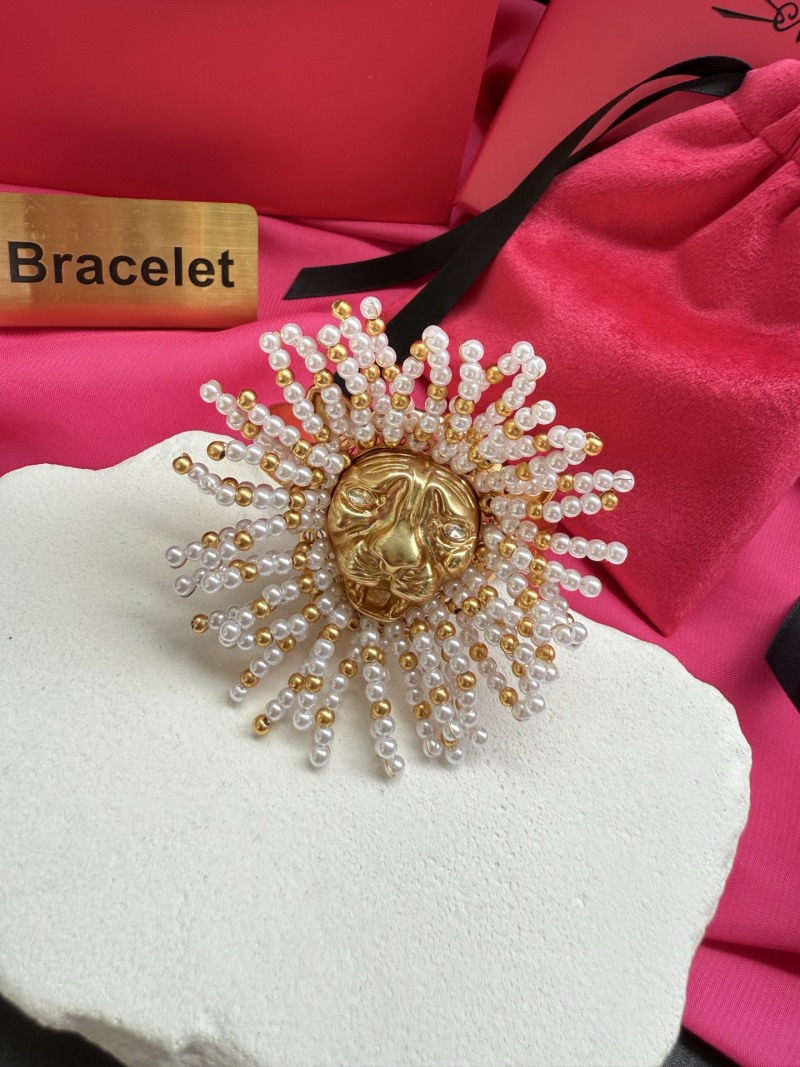 Браслет в виде солнца с лицом и жемчугом Schiaparelli