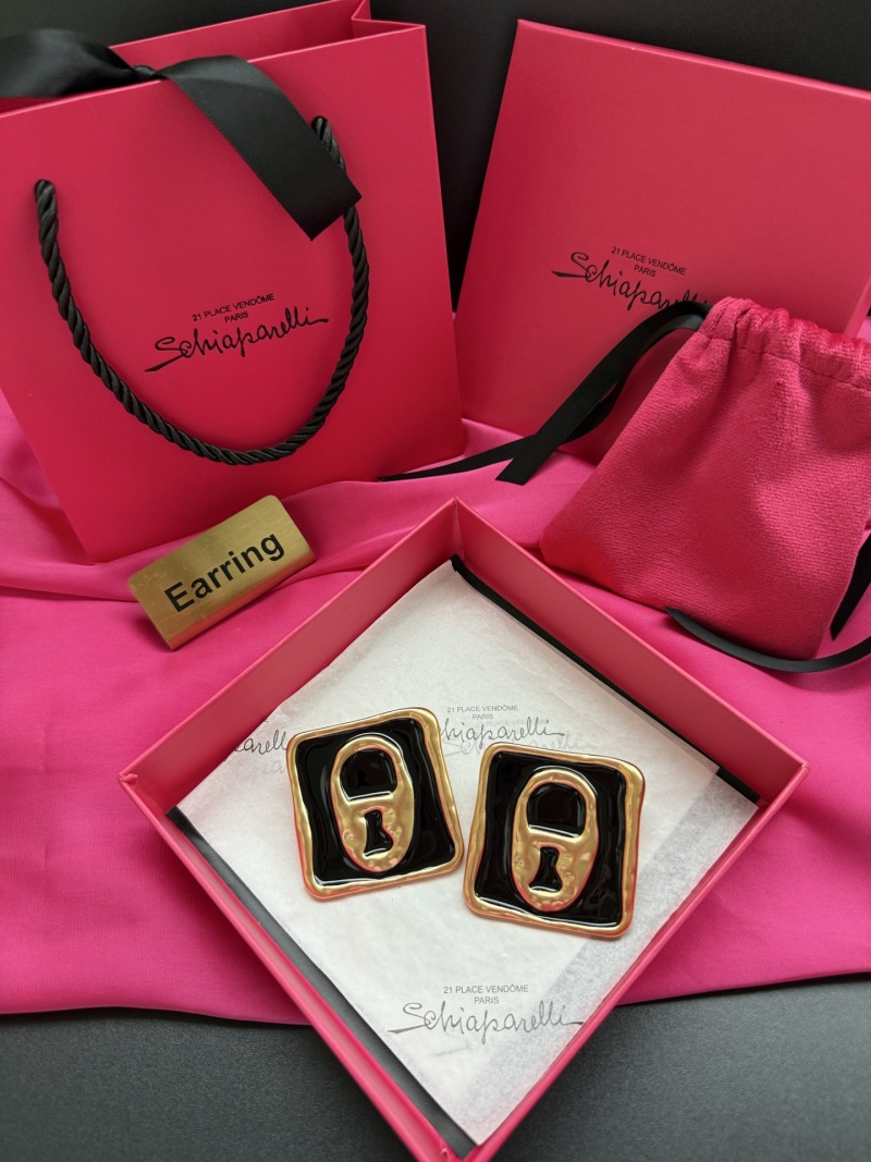 Серьги в форме замка Schiaparelli