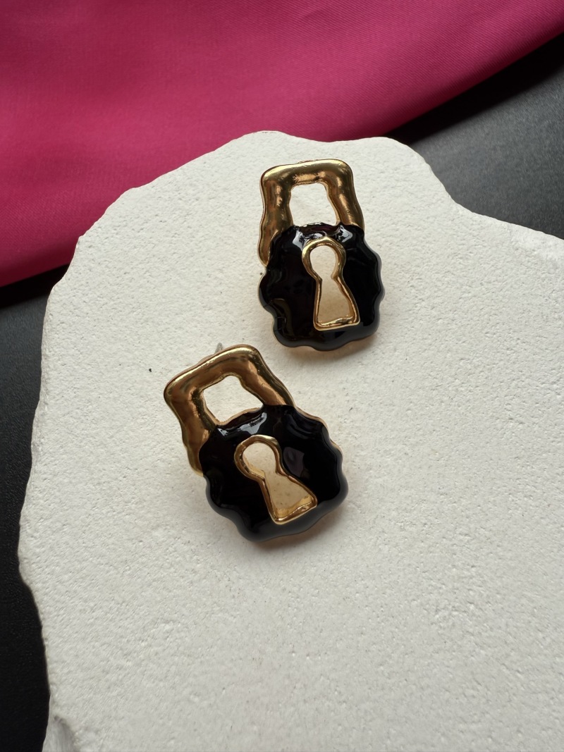 Серьги в виде замков Schiaparelli