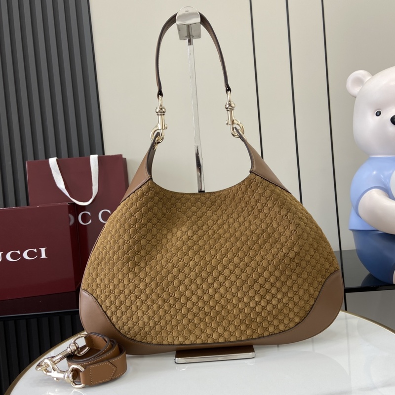 Сумка Gucci с монограммой и кожаной отделкой